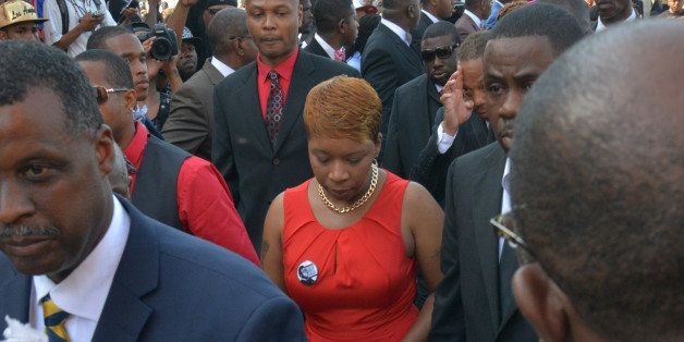 ST. LOUIS, MO - AUGUST 25:Lesley McSpadden, mother of Michael Brown, heads into Friendly Temple Missionary Baptist Church for the funeral of her son on Monday, August 25, 2014, in St. Louis, MO. Michael Brown, an 18-year-old African American male, was fatally gunned down by a White police officer, Darren Wilson, on August 9 in Ferguson, MO.(Photo by Jahi Chikwendiu/The Washington Post via Getty Images)