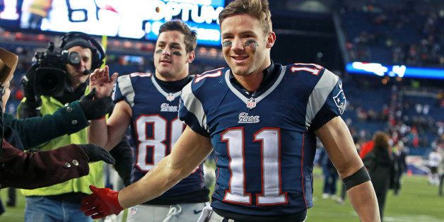 FOXBOROUGH, MA - DECEMBER 8: Patriots wide receivers Julian Edelman (#11) and Danny Amendola (#80), who each caught a late touchdown pass in the fourth quarter to give New England their miracle comeback victory, are all smiles as they leave the field following the game. The New England Patriots hosted the Cleveland Browns in an NFL regular season game at Gillette Stadium. (Photo by Jim Davis/The Boston Globe via Getty Images)