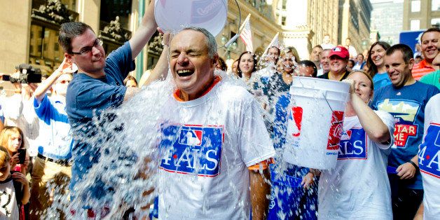 Major League Baseball Commissioner-elect Rob Manfred participates in the ALS Ice-Bucket Challenge outside the organization's headquarters in New York, Wednesday, Aug. 20, 2014. Manfred participated with more than 160 other MLB employees to raise more than $16,000 for the ALS Association. (AP Photo/Vanessa A. Alvarez)