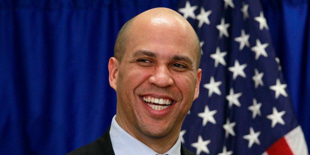 Newark Mayor Cory Booker smiles during a news conference announcing Cami Anderson as chief of the state-run Newark Public School system, Wednesday, May 4, 2011 in Newark, N.J. (AP Photo/Julio Cortez)