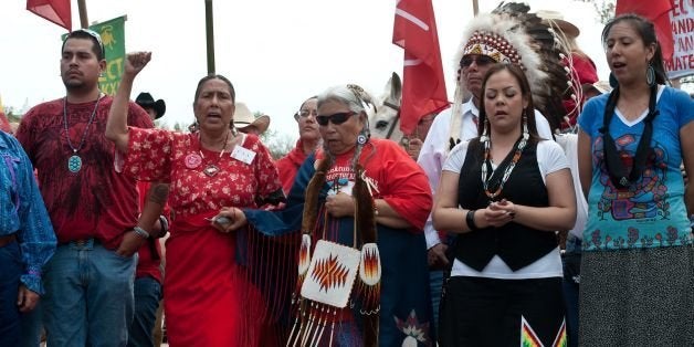 Native Americans hold a ceremony in front of the US Capitol in Washington on April 22, 2014 as the Cowboy and Indian Alliance protest the proposed Keystone XL pipeline, part of 'Reject and Protect,' a weeklong series of actions by farmers, ranchers and tribes against the tar sands oil pipeline from Canada to the US. AFP PHOTO/Nicholas KAMM (Photo credit should read NICHOLAS KAMM/AFP/Getty Images)