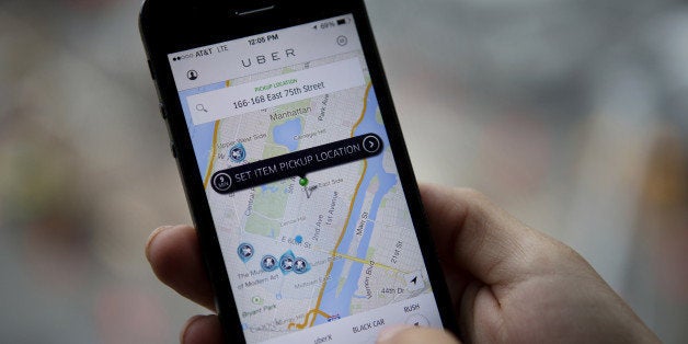 Th Uber Technologies Inc. car service application (app) is demonstrated for a photograph on an Apple Inc. iPhone in New York, U.S., on Wednesday, Aug. 6, 2014. For San Francisco-based Uber Technologies Inc. which recently raised $1.2 billion of investors' financing at $17 billion valuation, New York is its biggest by revenue among the 150 cities in which it operates across 42 countries. The Hamptons are a pop-up market for high-end season weekends where the average trip is three time that of an average trip in New York City. Photographer: Victor J. Blue/Bloomberg via Getty Images