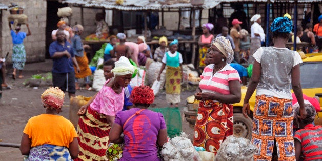 Women sell food stuff at one of the largest local markets in the city of Monrovia, Liberia, Friday, Aug. 15, 2014. The World