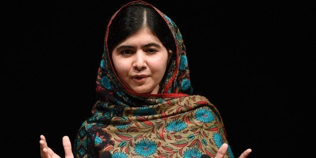 Pakistani rights activist Malala Yousafzai addresses the media in Birmingham, central England on October 10, 2014. The Nobel Peace Prize went Friday to 17-year-old Pakistani Malala Yousafzai and India's Kailash Satyarthi for their work promoting children's rights. Seventeen-year-old Nobel Peace Prize winner Malala Yousafzai said she was 'honoured' to be the first Pakistani and the youngest person to be given the award and dedicated the award to the 'voiceless'. 'This award is for all those children who are voiceless, whose voices need to be heard,' she said. AFP PHOTO / OLI SCARFF (Photo credit should read OLI SCARFF/AFP/Getty Images)