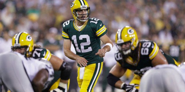 In this Aug. 22, 2014, photo, Green Bay Packers quarterback Aaron Rodgers approaches the line of scrimmage during the first half of an NFL preseason football game against the Oakland Raiders in Green Bay, Wis. Rodgers' first start at Seattle is making a lot of fantasy football owners squeamish. (AP Photo/Morry Gash)
