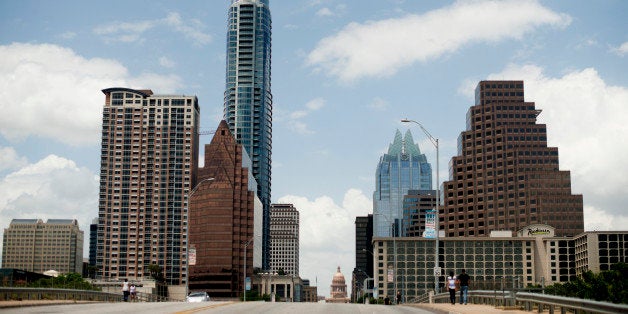 Buildings stand in the skyline of Austin, Texas,. U.S., on Friday, June 6, 2014. Localities in Texas, home to seven of the nation's 15 fastest-growing cities, are bearing the financial burden as the state gains 1,000 residents a day. Photographer: Ty Wright/Bloomberg via Getty Images