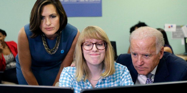 Vice President Joe Biden, right, and actress Mariska Hargitay, left, visit the headquarters of the National Domestic Violence Hotline in West Lake Hills, Texas, Wednesday, Oct. 30, 2013, to help commemorate National Domestic Violence Awareness Month (AP Photo/Eric Gay)