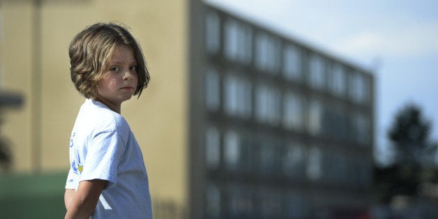 DENVER, CO. - SEPTEMBER 19: Olivia Calhoun, 9, stands outside the Crossing in Denver, CO September 19, 2014. Olivia and her family have lived at the Denver Rescue Mission's transitional program for families, since June 2013. The child poverty rate in Colorado dipped in 2013 for the first time since 2008. (Photo By Craig F. Walker / The Denver Post)