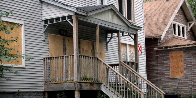 Homes are boarded-up with plywood in the Roseland neighborhood of Chicago, Illinois, U.S., on Wednesday, Aug. 28, 2013. Almost one in 10 Roseland properties is vacant and the areas homeownership rate fell to 57 percent in 2010 from 64 percent in 2000, according to the Woodstock Institute. Photographer: Tim Boyle/Bloomberg via Getty Images