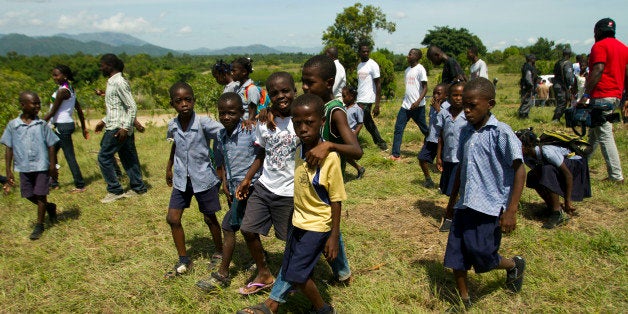 Children attend an event on ocassion of the World Environment Day in Ouanaminthe, Haiti on June 5, 2013. Haitian President Michel Martelly inaugurated a reforestation program. AFP PHOTO / ERIKA SANTELICES (Photo credit should read ERIKA SANTELICES/AFP/Getty Images)