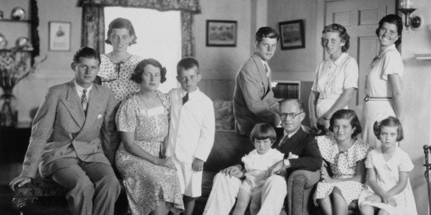 Portrait of the Kennedy family in their living room, Brookline, Massachussetts, 1930s. Front row from left: Joseph P Kennedy