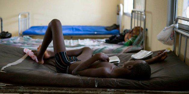 A child suffering from the Ebola virus receives treatment at Makeni Arab Holding Centre in Makeni, Sierra Leone, Saturday, Oct. 4, 2014. Makeni is one of three districts recently quarantined by the government. (AP Photo/Tanya Bindra)