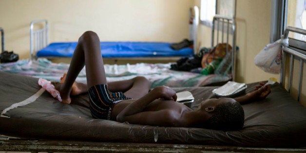 A child suffering from the Ebola virus receives treatment at Makeni Arab Holding Centre in Makeni, Sierra Leone, Saturday, Oc
