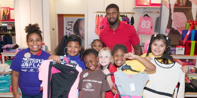 FAYETTEVILLE, GA - DECEMBER 02: Atlanta Falcon Devin Hester surprises the Boys & Girls Club of Metro Atlanta with a holiday shopping spree for #GivingTuesday at JCPenney in Fayetteville, Georgia. (Photo by Marcus Ingram/Getty Images for JCPenney)