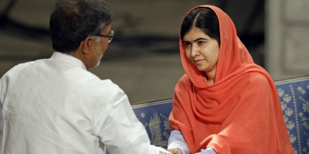 Nobel Peace Prize winners Malala Yousafzai from Pakistan and Kailash Satyarthi of India shake hands during the Nobel Peace Pr