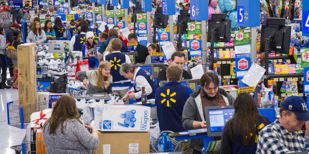 IMAGE DISTRIBUTED FOR WALMART - Customers wrap up their holiday shopping during Walmart's Black Friday events on Thursday, Nov. 27, 2014 in Bentonville, Ark. Deep savings continue at Walmart Friday though Cyber Monday as part of five days of events in stores and online. (Photo by Gunnar Rathbun/Invision for Walmart/AP Images)