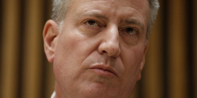 New York City Mayor Bill de Blasio listens to questions during a news conference at police headquarters in New York, Monday, Dec. 22, 2014. De Blasio called Monday for a pause in protests over police conduct as he faced a widening rift with those in a grieving force who accuse him of creating a climate of mistrust that contributed to the execution of two officers. (AP Photo/Seth Wenig)