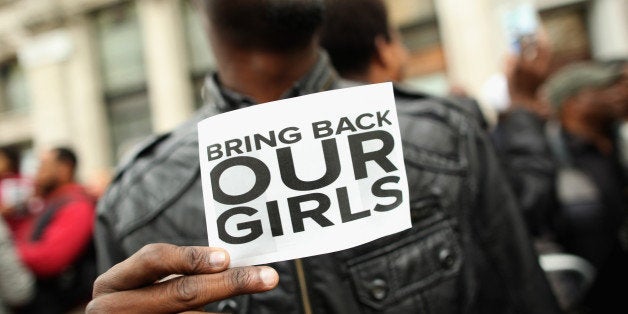 LONDON, ENGLAND - MAY 09: A man holds a sign that reads 'Bring back our girls' during a protest outside Nigeria House on May 9, 2014 in London, England. 276 schoolgirls were abducted from their boarding school on 14 April, 2014 in the town of Chibok in north-eastern Borno state in Nigeria. The abductions have sparked protests around the world calling for the release of the girls who are being held by the militant group Boko Haram. (Photo by Dan Kitwood/Getty Images)