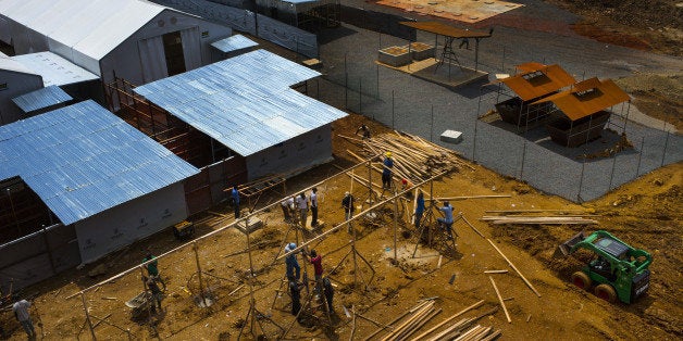 MONROVIA, LIBERIA-NOVEMBER 1: Workers continue construction at the new Ebola Treatment Unit now called 'MOD' which is located on an old unfinished Ministry of Defense property, on Saturday November 1, 2014 in Monrovia, Liberia. This government of Liberia treatment facility was expected to be open Monday with 100 beds. The unit will eventually have a capacity of up to 300 beds. (Photo by Michel du Cille/The Washington Post via Getty Images)