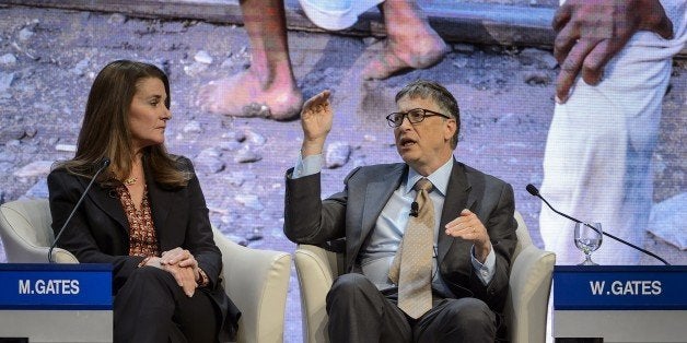 Melinda and Bill Gates attend a session at the Congress Center during the World Economic Forum (WEF) annual meeting on January 23, 2015 in Davos. AFP PHOTO / FABRICE COFFRINI (Photo credit should read FABRICE COFFRINI/AFP/Getty Images)