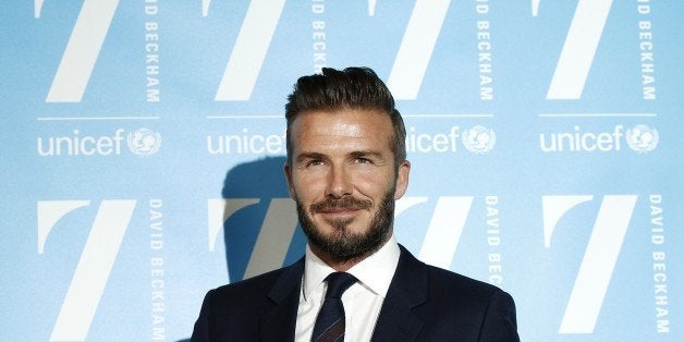 Former England footballer David Beckham poses for a photograph during the launch of '7', an initiative with children's charity UNICEF, in London on February 9, 2015. Beckham is celebrating 10 years as a goodwill ambassador. The lauch of '7', named in honour of Beckham's number on his famous England and Manchester United football shirt, is aiming to protect millions of children around the world from danger. AFP PHOTO / ADRIAN DENNIS (Photo credit should read ADRIAN DENNIS/AFP/Getty Images)