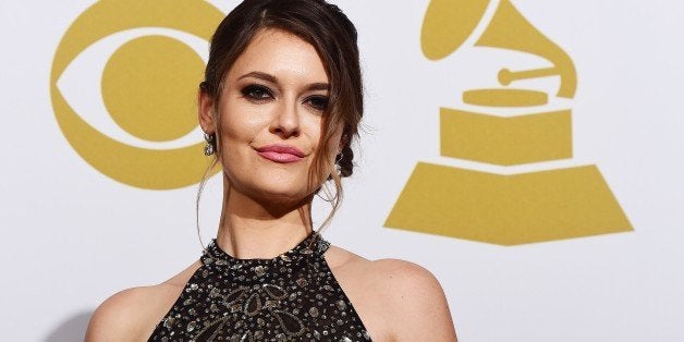 Presenter Brooke Axtell poses in the press room during the 57th annual Grammy Awards in Los Angeles, California on February 8, 2015. AFP PHOTO / FREDERIC J. BROWN (Photo credit should read FREDERIC J. BROWN/AFP/Getty Images)