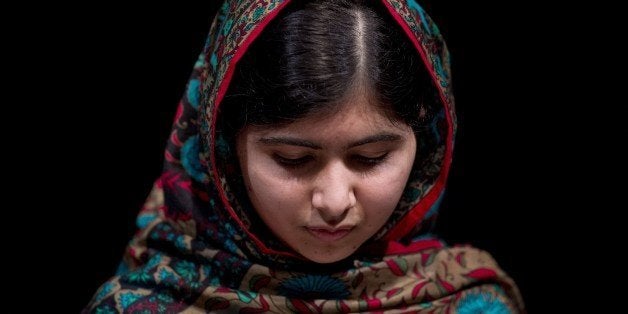 Pakistani rights activist Malala Yousafzai addresses the media in Birmingham, central England on October 10, 2014. The Nobel Peace Prize went Friday to 17-year-old Pakistani Malala Yousafzai and India's Kailash Satyarthi for their work promoting children's rights. Seventeen-year-old Nobel Peace Prize winner Malala Yousafzai said she was 'honoured' to be the first Pakistani and the youngest person to be given the award and dedicated the award to the 'voiceless'. 'This award is for all those children who are voiceless, whose voices need to be heard,' she said. AFP PHOTO / OLI SCARFF (Photo credit should read OLI SCARFF/AFP/Getty Images)