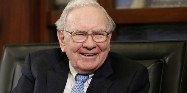 Berkshire Hathaway Chairman and CEO Warren Buffett laughs during an interview with Liz Claman on the Fox Business Network in Omaha, Neb., Monday, May 5, 2014. The annual Berkshire Hathaway shareholders meeting concluded over the weekend. (AP Photo/Nati Harnik)