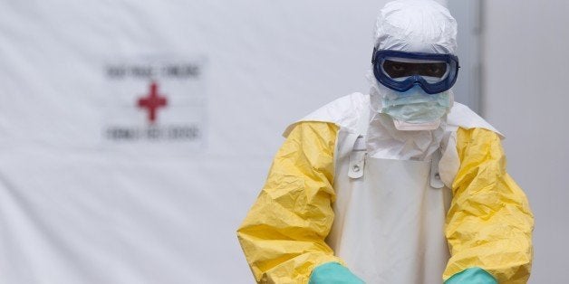 A health worker wearing a personal protective equipment (PPE) works at the Ebola treatment center run by the French red cross