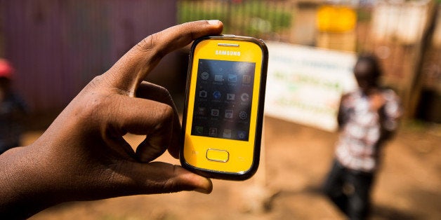 A Samsung Electronics Co. mobile phone is displayed for a photograph in Nairobi, Kenya, on Sunday, April 14, 2013. In the six years since Kenya's M-Pesa brought banking-by-phone to Africa, the service has grown from a novelty to a bona fide payment network. Photographer: Trevor Snapp/Bloomberg via Getty Images