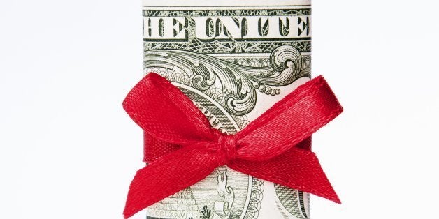 one dollar bill wrapped with a red bow