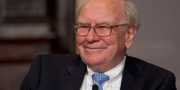 Warren Buffett, chairman and chief executive officer of Berkshire Hathaway Inc., smiles during a conversation with Brian Moyn