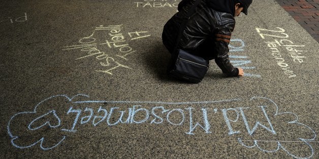 Fashion Institute of Technology (FIT) students write the name of 146 factory workers who died in the Triangle Shirtwaist Factory fire in chalk in front of a exhibition at FIT March 23 2011. The Triangle Shirtwaist Factory fire in New York City on March 25, 1911, was the deadliest industrial disaster in the history of the city of New York and resulted in the fourth highest loss of life from an industrial accident in US history. AFP PHOTO / TIMOTHY A. CLARY (Photo credit should read TIMOTHY A. CLARY/AFP/Getty Images)