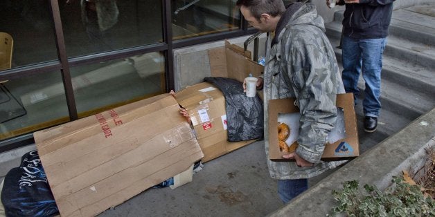 Marc Berrier, right, looks out for homeless people to pass out coffee and donuts during the Seattle Union Gospel's Morning Watch program, Nov. 18, 2013, in Seattle. (Renee C. Byer/Sacramento Bee/MCT via Getty Images)