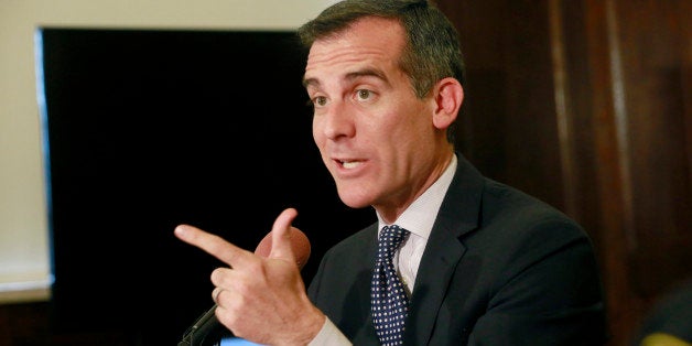 Los Angeles Mayor Eric Garcetti comments on the shooting of a homeless man on Skid Row during a "brutal" videotaped struggle in which a rookie Los Angeles police officer cried out that the man had grabbed his gun, at a news conference in City Hall on Monday, March 2, 2015. "I watched the video, I watched the tragic events on Skid Row unfold," the mayor said. "We owe the city a thorough investigation as to what happened." The shooting was caught by at least four cameras, two held by witnesses and two worn by officers who fired their weapons. There was also a camera in a police car and a security camera on a nearby shelter that may have captured footage. (AP Photo/Nick Ut)