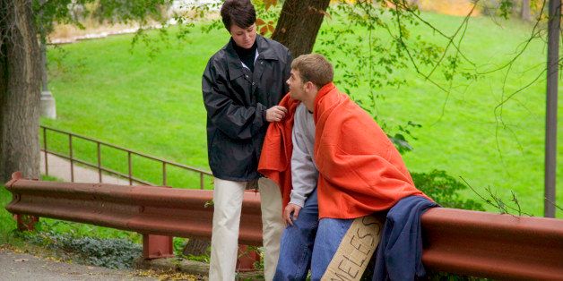Social worker helping homeless teenage boy