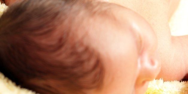 Stethoscope listening to a baby's heart beat