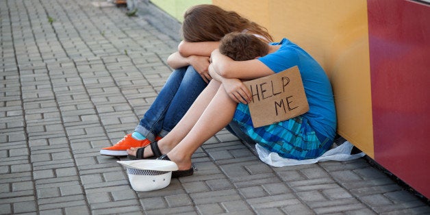 homeless teenage boy and girl...