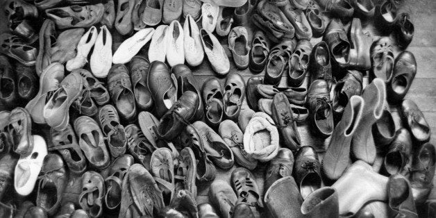 Dozens of pairs of children's shoes, piled up ready for cleaning. Original Publication: Picture Post - 5690 - A New Way with Orphans - pub. 1952 (Photo by Thurston Hopkins/Getty Images)