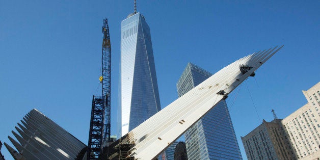 The World Trade Center transportation hub is under construction, November 20, 2014 in New York. The building is designed by Spanish architect Santiago Calatrava. One World Trade Center stands in the center background. (AP Photo/Mark Lennihan)