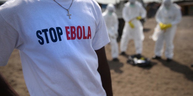 MONROVIA, LIBERIA - JANUARY 29: A Liberian Red Cross burial team undresses from their personal protective equipment (PPE), after collecting a body for a 'safe burial' in the West Point township on January 29, 2015 in Monrovia, Liberia. They took a swab sample to test for Ebola, although no new cases have been discovered in West Point in more than 21 days. The World Health Organization (WHO), announced that in the last week there were less than 100 new Ebola cases in all of West Africa, with a dramatic decrease in Liberia, where the numbers are in the single digits. The WHO said their focus has now shifted from slowing transmission to ending the epidemic. (Photo by John Moore/Getty Images)