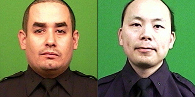 FILE - This combination made from photos provided by the New York Police Department shows officers Rafael Ramos, left, and We