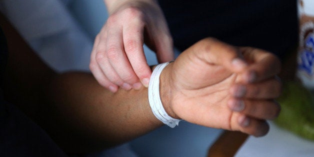 BIRMINGHAM, ENGLAND - JANUARY 22: Editors Note: This image may have been digitally manipulated for confidentiality to remove any patient identidy data. A nurse checks the pulse of a patient at Birmingham Women's Hospital on January 22, 2015 in Birmingham, England. Birmingham Womens Hospital provides a range of health services to women and their families using the latest scientific procedures and care. Last year the maternity unit delivered over 8,000 babies, cared for 50,000 patients and performed over 3000 procedures in its state of the art theatres. The hospital is also home to world renowned research scientists, fertility clinic and the national sperm bank. (Photo by Christopher Furlong/Getty Images)