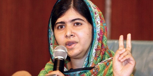 Pakistani education activist Malala Yousafzai gives a press conference on July 14, 2014 after meeting with the Nigerian president in Abuja. Malala on July 14 urged Nigerian President Goodluck Jonathan to meet with parents of the schoolgirls kidnapped three months ago by Boko Haram. Malala, who survived a Taliban assassination attempt in 2012 and has become a champion for access to schooling, was in Abuja on her 17th birthday to mark the somber anniversary of Boko Haram's April 14 abduction of 276 girls from a secondary school in the northeast Nigerian city of Chibok. AFP PHOTO / WOLE EMMANUEL (Photo credit should read WOLE EMMANUEL/AFP/Getty Images)