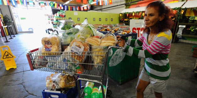 LOS ANGELES, CA - SEPTEMBER 17: Norma Lopez pushes cart full of groceries out the World Harvest food bank on September 17, 2010 in Los Angeles, California. For a nominal donation or an exchange of a few hours of work people can receive a cart full of groceries. The U.S. poverty rate increased to a 14.3 percent in 2009, the highest level since 1994. (Photo by Kevork Djansezian/Getty Images)