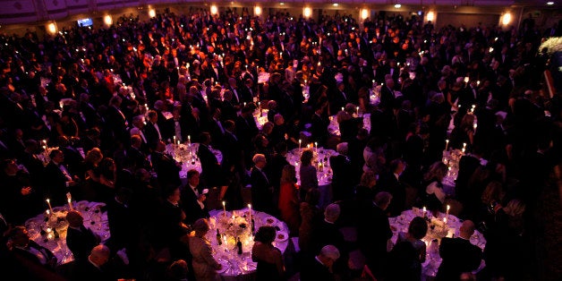 Audience members stand at the 67th annual Alfred E. Smith Memorial Foundation Dinner, a charity gala organized by the Archdio