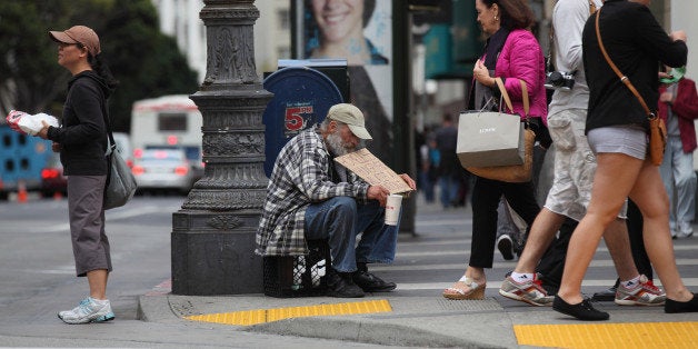 SAN FRANCISCO - SEPTEMBER 16: A homeless man holds a sign as he panhandles for spare change on September 16, 2010 in San Francisco, California. The U.S. poverty rate increased to a 14.3 percent in 2009, the highest level since 1994. (Photo by Justin Sullivan/Getty Images)