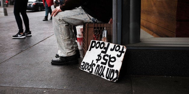 NEW YORK, NY - APRIL 07: A man panhandles for money and food on April 7, 2015 in New York City. A new report released today from 'Homes for Every New Yorker' a coalition of activist groups that makes recommendations for New York Mayor Bill de Blasio to fight homelessness in the city . The report , which was unveiled at City Hall on Tuesday, advocates that where homeless advocates that the mayor put aside 10% of all units in his affordable housing plan for shelter residents, raise the minimum wage and to invest in programs to prevent tenants from falling into homeless. (Photo by Spencer Platt/Getty Images)