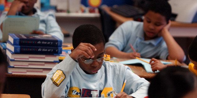 ** ADVANCE FOR SATURDAY MARCH 12 ** Third grader Terrell Haskins studies his class work at Bonsall School in Camden, N.J. Thursday, March 10, 2005. Schools in Camden are using a new program of standardized tests to help prepare students of the state's annual exam. (AP Photo/Brian Branch-Price)