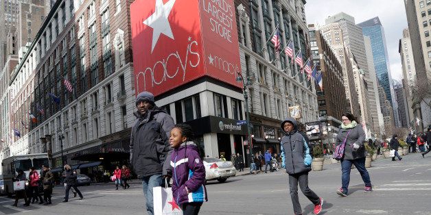 In this Feb. 19, 2015 photo, Macy's shoppers leave the retailer's flagship store, Thursday, Feb. 19, 2015 in New York. Macy's Inc. reports quarterly financial results before the market opens Tuesday, Feb. 24, 2015. (AP Photo/Mark Lennihan)